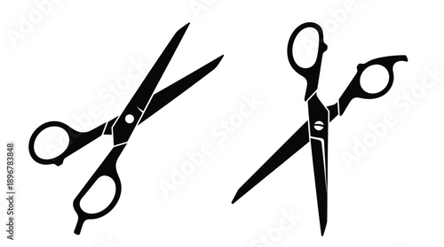 Two pairs of scissors depicted in a stark black silhouette