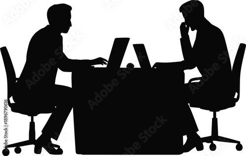 Silhouettes of two businessmen sitting opposite each other at a large desk working on laptops during a serious meeting.