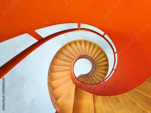 Bright orange spiral staircase
