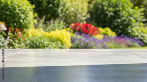 Blurred background of lush green garden with table surface in foreground for product display