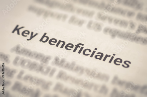 Foto Document Highlighting 'Key Beneficiaries' Phrase Emphasizing Financial or Legal