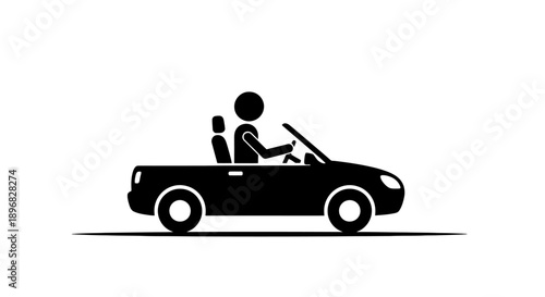 Silhouette of a person driving a convertible car.
