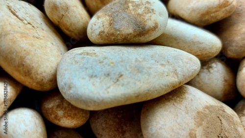 Close-Up of Smooth River Pebbles with Earthy Tones