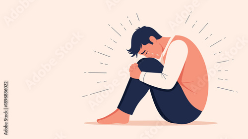 Sad man sitting alone on the ground hugging his knees with tears in his eyes, representing loneliness, sorrow, and despair.