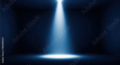Dramatic spotlight effect with bright blue light beam in dark background