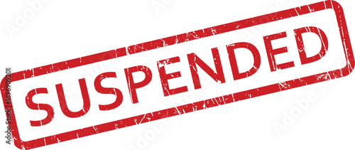 A rectangular red rubber stamp with a distressed texture showing the word SUSPENDED on a bright white surface