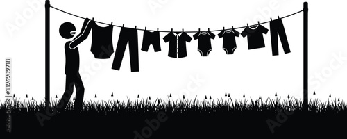 Silhouette of person hanging laundry on clothesline with various garments, outdoor garden scene, household chore concept