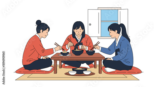 Three young women wearing colorful traditional Korean Hanbok dresses sitting at a low table and enjoying a meal with bowls of noodles.