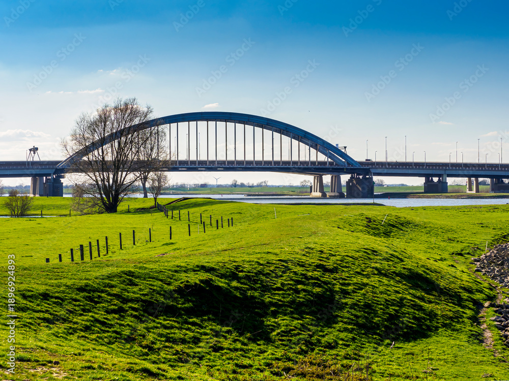 Fototapeta premium Historic Lek bridge spanning Lek river near Vianen