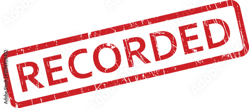 A vintage textured red rectangular rubber stamp displays the word recorded diagonally on a clean white surface