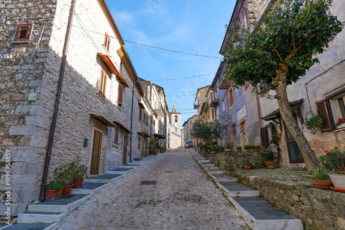A street among the old houses of  Pisterzo, a farming village in the Lazio region, Italy.