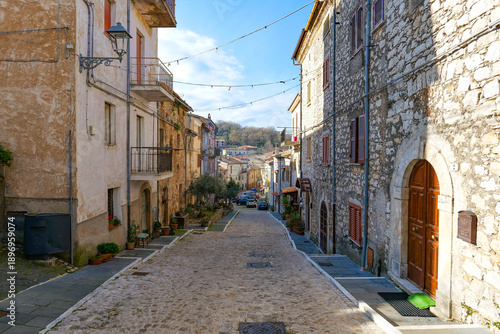A street among the old houses of  Pisterzo, a farming village in the Lazio region, Italy.