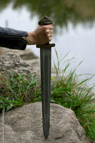 Sword on the big stone.