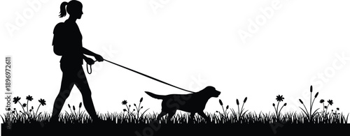 Silhouette of woman walking dog on leash through grassy field with flowers, enjoying outdoor stroll, peaceful nature and pet companionship