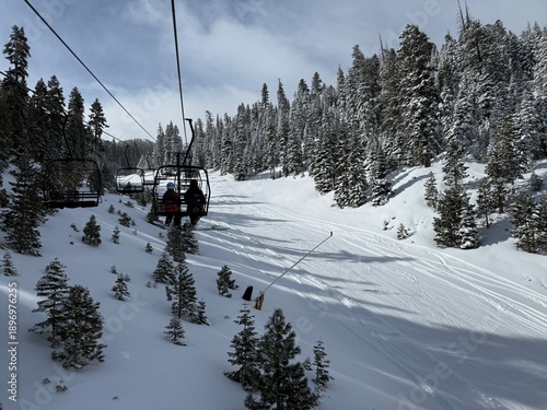 
View from the chairlift of the trees and trails on the ski slopes of Heavenly Ski Resort in Lake Tahoe in the winter
