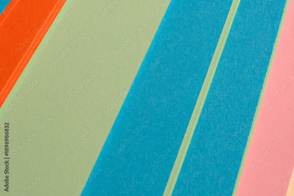 Obraz premium Colorful striped paper lies flat in a vibrant display of hues