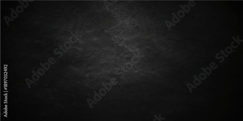 A dark and black grunge background features a textured old concrete wall surface with a dirty gray vintage paper pattern, creating a blank rough stone backdrop for a moody design