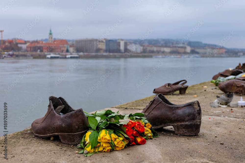 Fototapeta premium Bronze shoes and boots along the Danube river to commemorate to those who die in World War, memorial, Budapest, Hungary