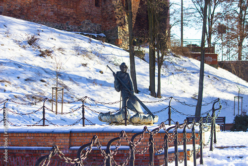 Brass statue of traditional Polish raftsman. winter. Grudziadz