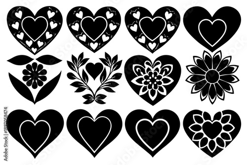 A sophisticated collection of ornate black heart shapes adorned with intricate white floral and leaf patterns and smaller hearts, creating a decorative ensemble.