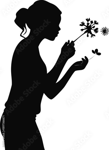 Silhouette Of A Woman Smelling A Wild Flower