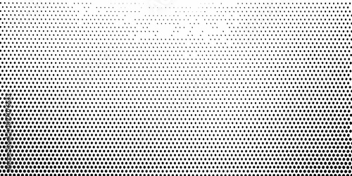 A gradient of dots transitioning from dense to sparse creating a visual effect