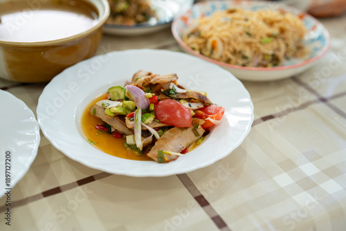 Foto Thai Spicy grilled pork jowl salad