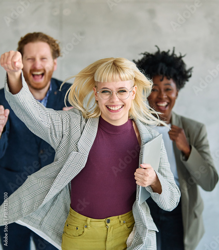 Wallpaper Mural Group of young  business people having fun organizing a race during a meeting  in the office. Teamwork and success concept Torontodigital.ca