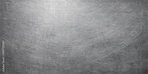 A dark gray vintage brushed metal plate with a grunge textured surface and old aged concrete patterns for a rough industrial wall backdrop design