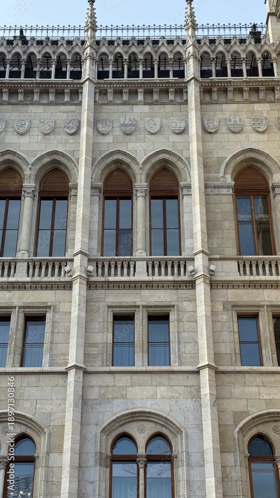 Obraz premium Facade of Parliament old building with windows detail in Budapest