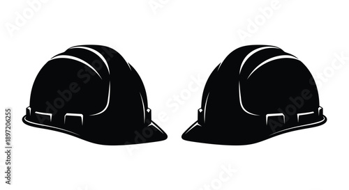 Two black construction helmets displayed against a white background silhouette