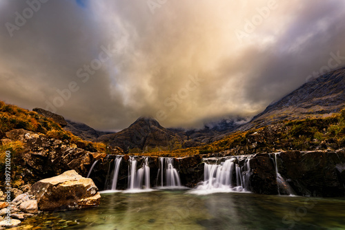 Wallpaper Mural Fairy Pools waterfalls on the Isle of Skye, Scotland, with clear mountain pool, silky flowing water and dramatic low clouds around the Cuillin mountains, iconic Scottish landscape. Torontodigital.ca