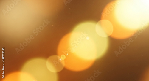 Warm golden lights blur softly in a diagonal pattern on a brown background