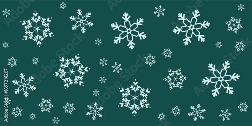 Elegant White Snowflakes Falling on a Deep Green Background.