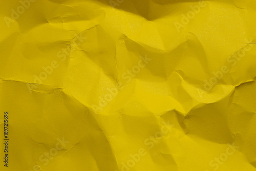 Wallpaper Mural The background has a textured surface resembling wrinkled bright yellow paper,Macro,Close-up top view of a crumpled and wrinkled sheet of vibrant yellow paper. The texture features sharp creases. Torontodigital.ca