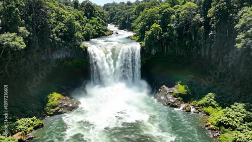 Wallpaper Mural Majestic Waterfall Cascades Through Lush Green Jungle With Bright Sunlight Creating Mist And Rainbows Torontodigital.ca