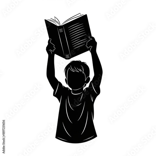 A young boy holding up an open book with both hands in a celebratory gesture