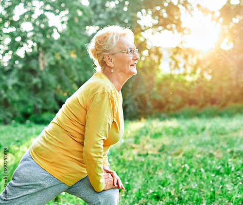 Wallpaper Mural Smiling active senior people stretching and exercising together in the park, healthy lifestile workout fitness training class Torontodigital.ca