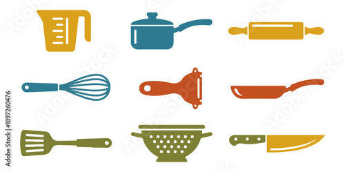 Assortment of kitchen utensils against a black background
