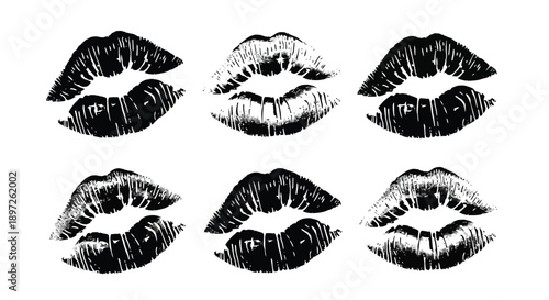 Set of black lipstick kiss marks on white background.