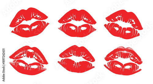 Vibrant red lipstick kiss marks on white background.