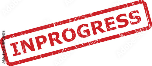 Textured red rubber stamp clearly displaying the word INPROGRESS on a crisp white surface