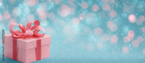 Gift box with pink ribbon on blue background with lights during holiday season