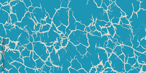 Abstract pattern of light reflections on the surface of blue water.