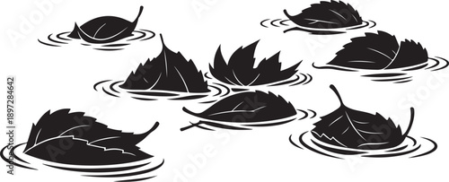 Black leaves floating on water with ripples isolated white