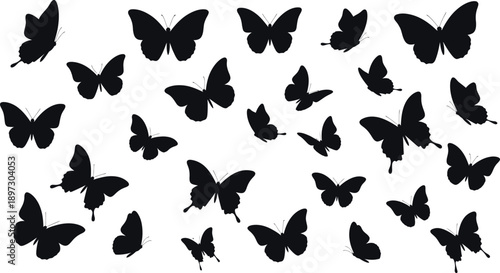 A group of black butterflies in silhouette flying together on a white background
