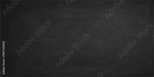 A dark, vintage chalkboard surface with a blank, grunge texture and gray chalk dust on a weathered, black wall pattern for a textured design backdrop