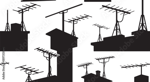 Black silhouettes of television antennas on rooftops background image