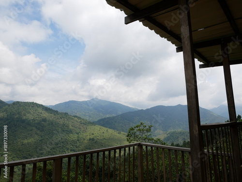 Panoramic view of green mountains from covered terrace