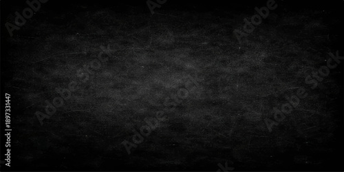 Vintage black and white abstract grunge background featuring a dark textured paper surface with an old blank concrete wall pattern for a dirty grey chalkboard design backdrop